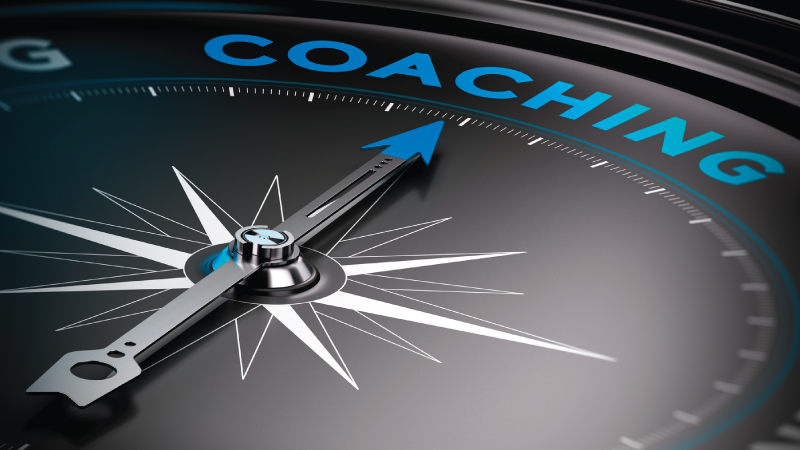 Compass Pointing to the word Coaching